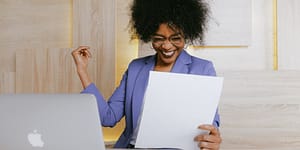 woman holding a paper