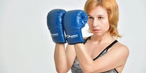 young female boxer in defense stance