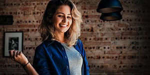 woman wearing blue button up jacket