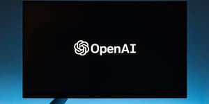 monitor screen with openai logo on black background