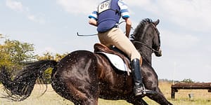person horseback riding outdoors